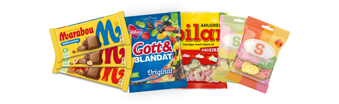 A delightful array of Swedish candy, featuring renowned brands like Malaco, Bilar, and Marabou, is beautifully arranged on a pristine white background.