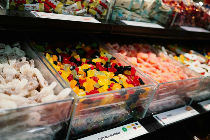 A vibrant Swedish candy store featuring a wide variety of colorful pick and mix candies, including iconic Swedish sweets in different shapes, flavors, and textures, perfect for candy lovers.